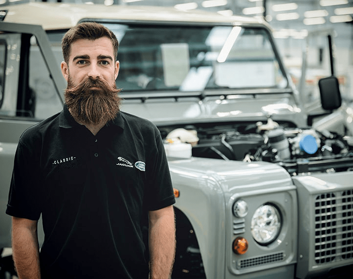 A man stood in front of an Islay Defender.
